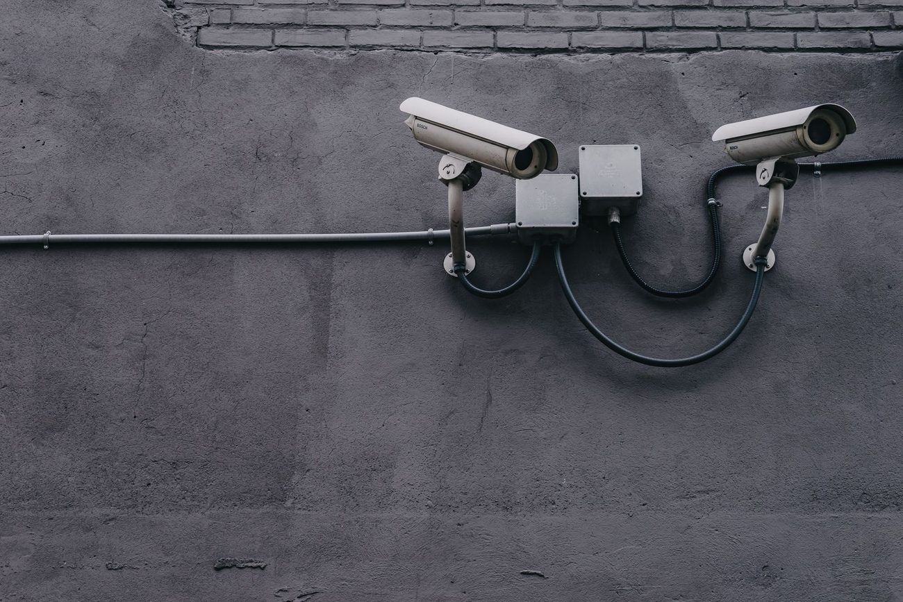 Surveillance cameras mounted on a wall