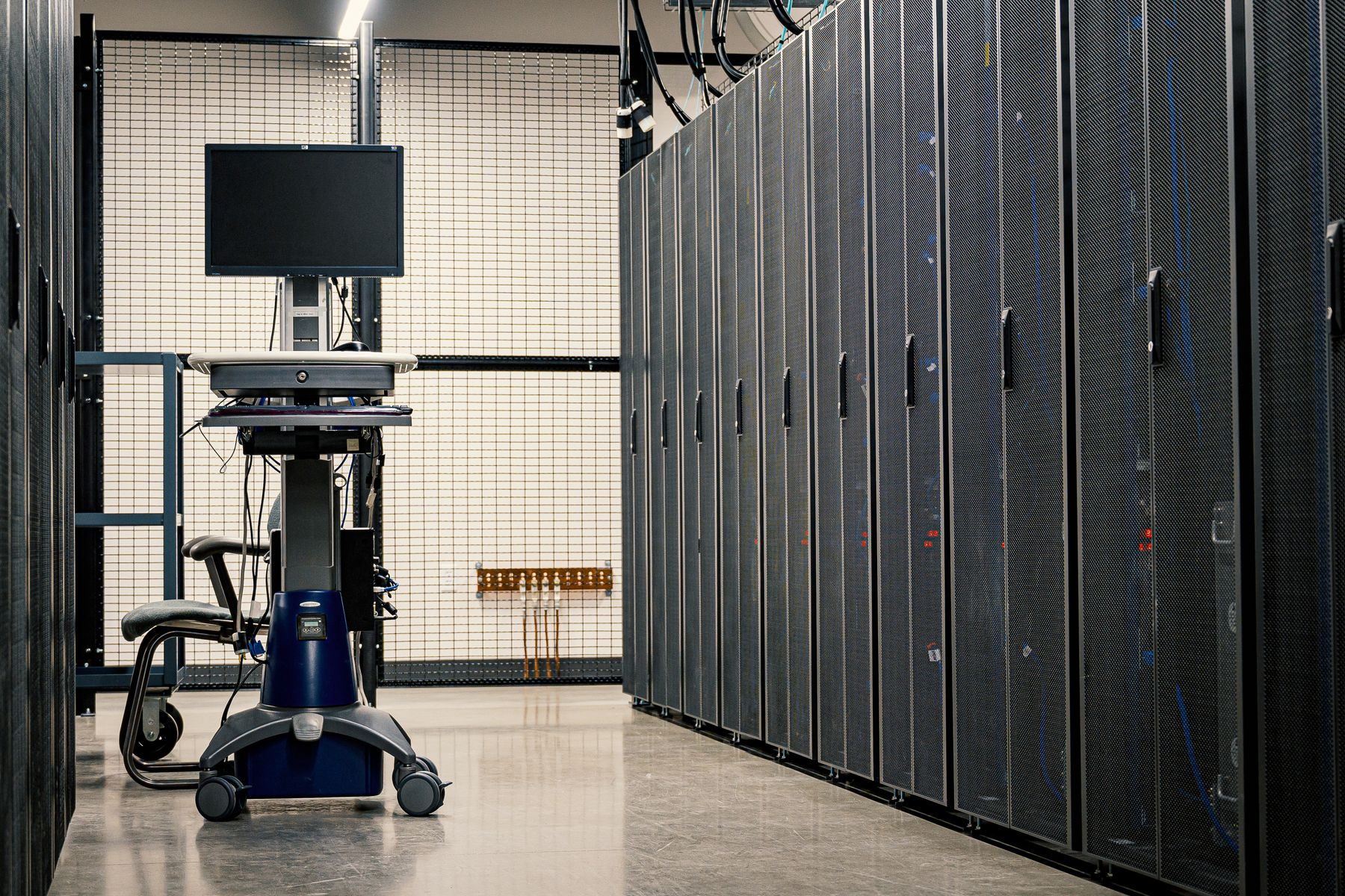 A data centre aisle lined with equipment racks