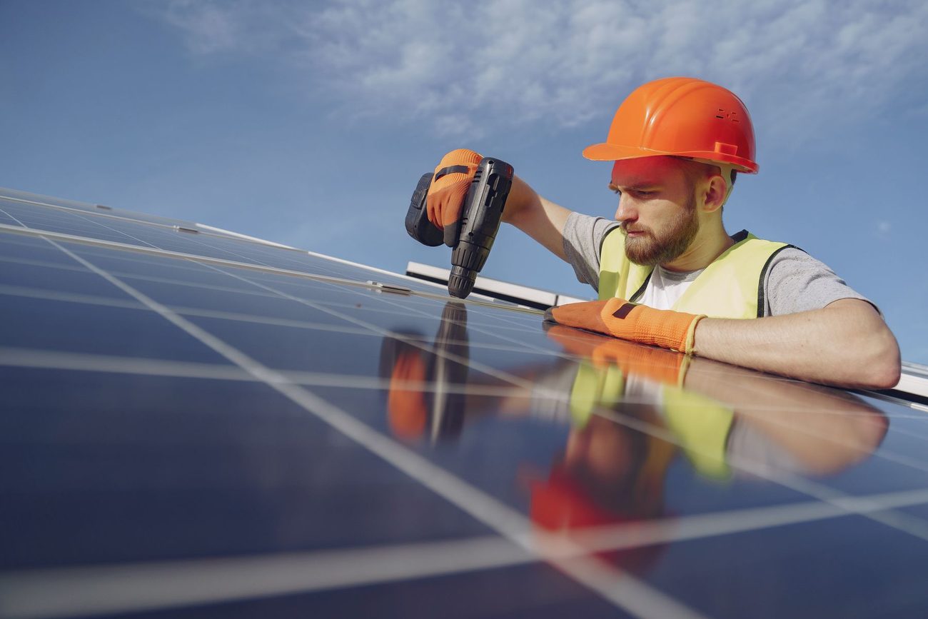 Technician installing solar panels